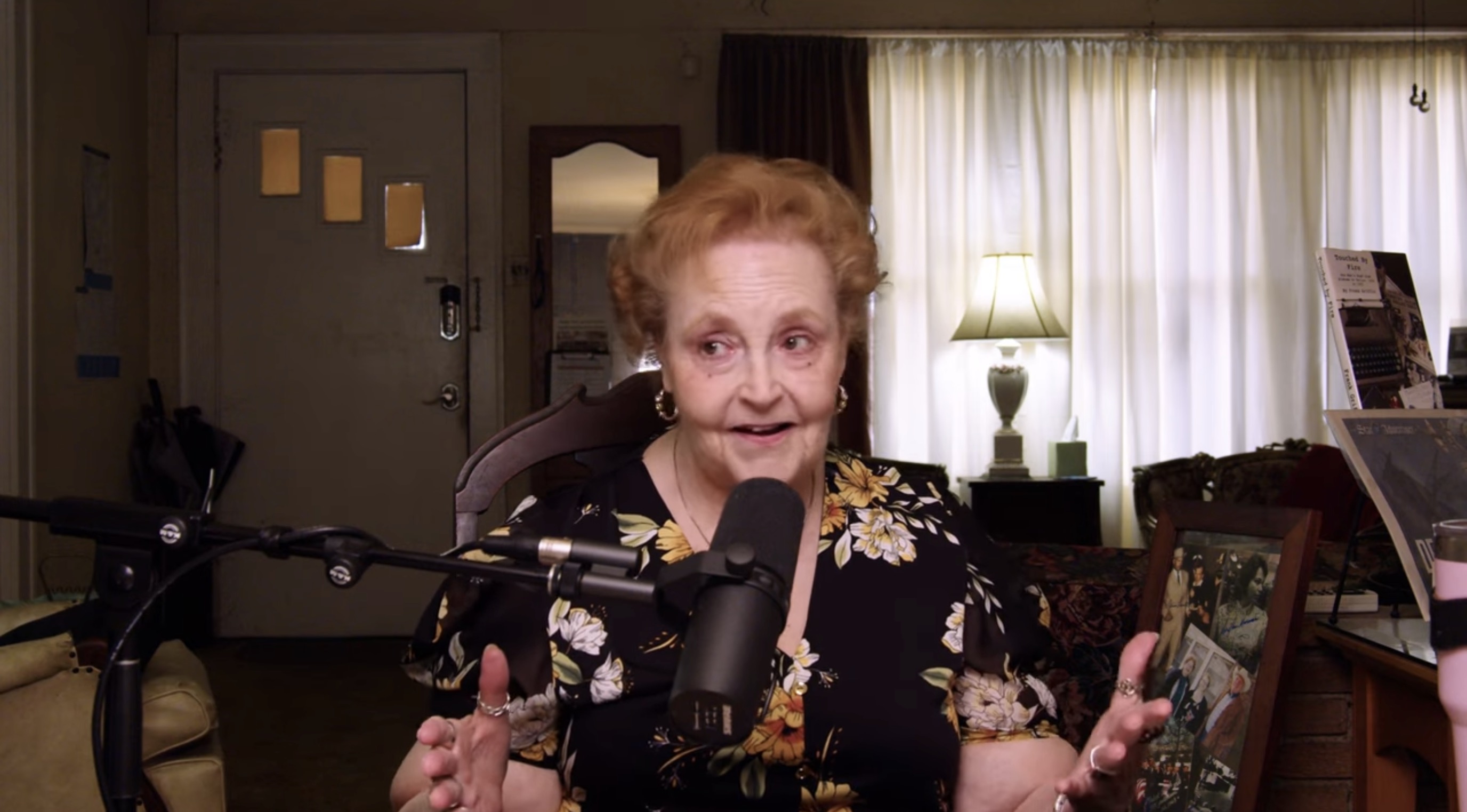 Patricia Puckett-Hall speaking into a microphone during the Hidden City interview